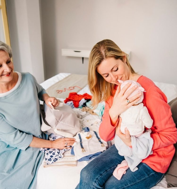 mother-holding-baby_23-2147791558